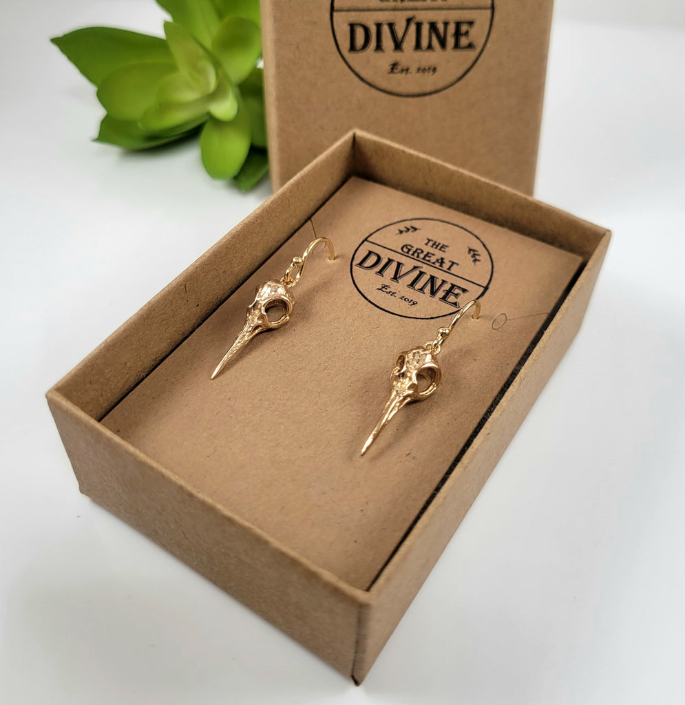 gold hummingbird skull earrings